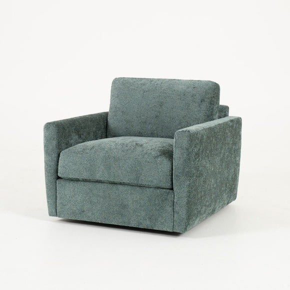 Green fabric armchair on a white background