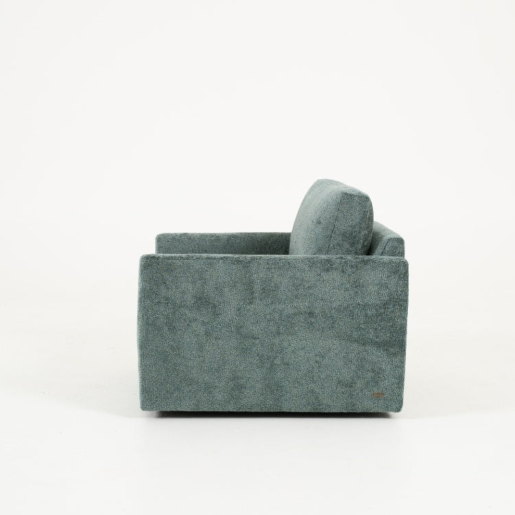 Side view of green armchair
