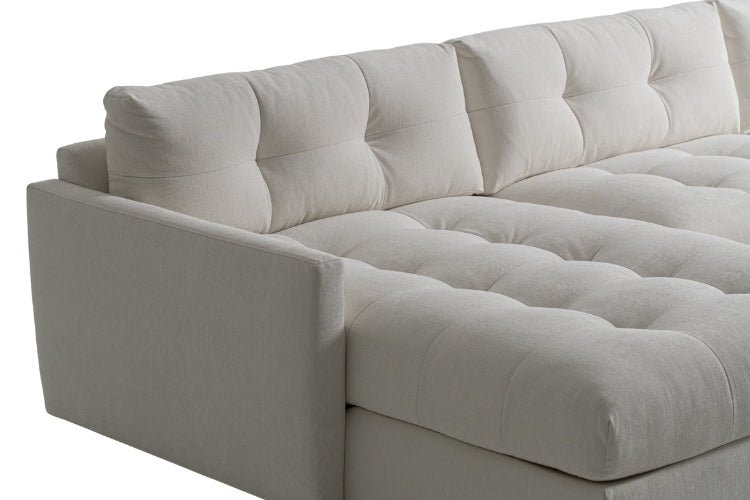 Carmet Elements Sectional in white with tufted cushion close up view of arm and cushions