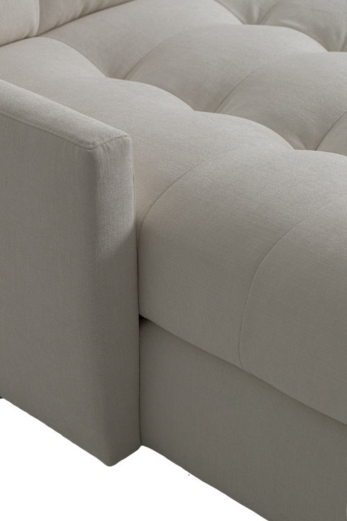 Carmet Elements Sectional in white with tufted cushion close up view of edge of cushion