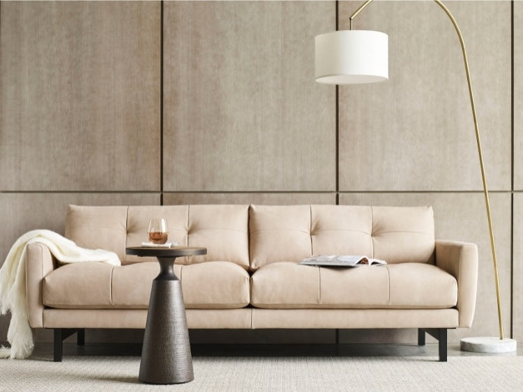 Carmet Elements Sofa high leg in decorated room with lamp, table, and blanket
