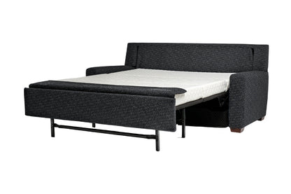 Dark Grey sectional sofa bed pulled out to full size showing white mattress. 