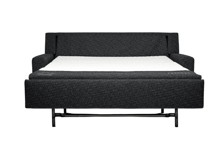 Black sectional sofa bed pulled out to full size showing white mattress. 