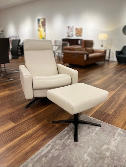 Cloud Chair and Ottoman by American Leather is featured in Grade D Capri Sand Dollar with a Bronze Star Base.