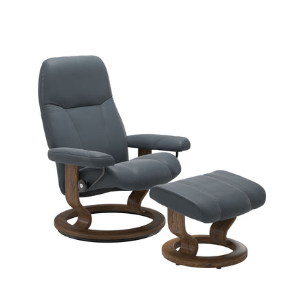 Front view of Stressless Consul Small Recliner and Ottoman in Batick Atlantic Blue with Classic Base in teak
