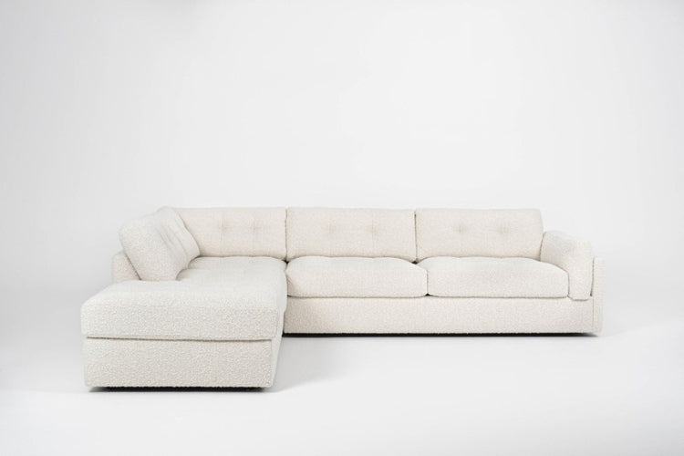 Beige sectional sofa on a white background with L shape