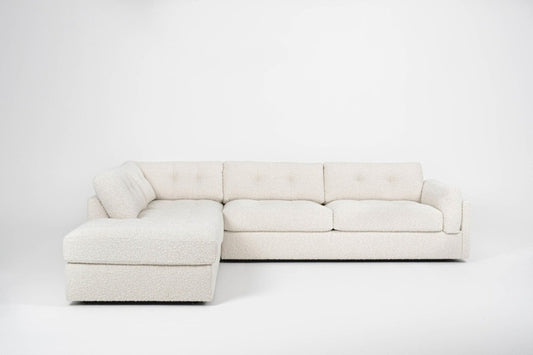 Beige sectional sofa on a white background with L shape