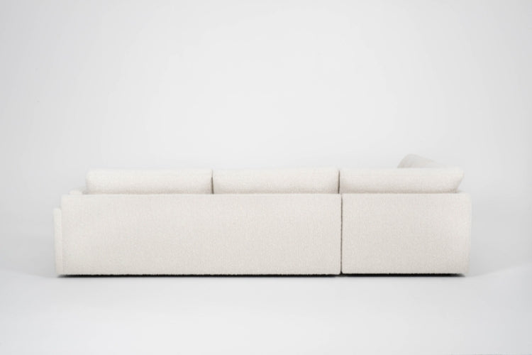 Back view of Beige sectional sofa on a white background