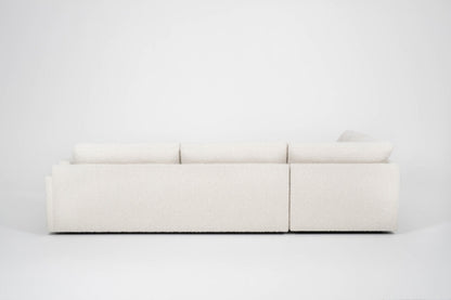 Back view of Beige sectional sofa on a white background