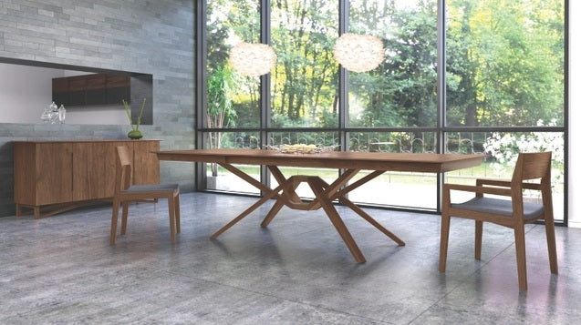 Exeter Extension Table walnut extended in a decorated room with chairs and a buffet.