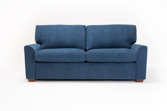 Blue fabric sofa bed with curved arms and wood legs