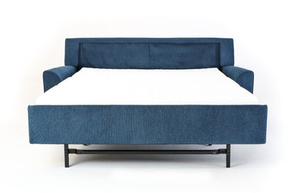 Blue fabric sofa bed pulled out into bed setting