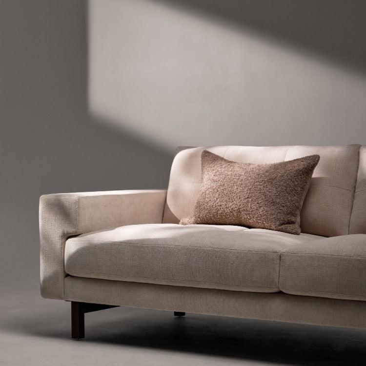 Lawson Elements Sofa high leg with tufted cushions close up angled view