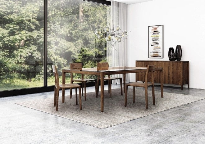 Lisse Glass Top Table in decorated room with Lisse Chairs, Lisse Buffet, and rug.