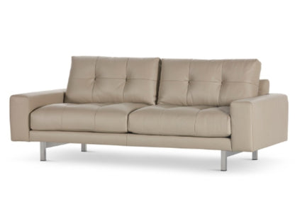 Montara Sofa high leg in beige with tufted cushions angled view
