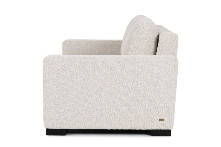 Side view of Beige armchair on a white background