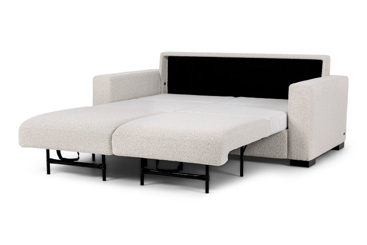 Beige sofa bed opened with extensions 