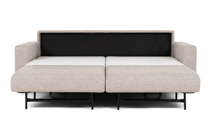 Beige fabric sectional sofa bed pulled out to full size showing white mattress. 