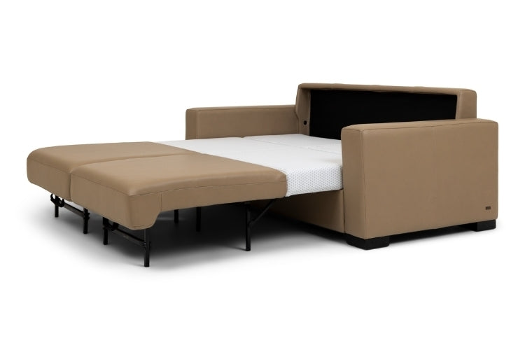 Brown sectional sofa bed pulled out to full size showing white mattress. 