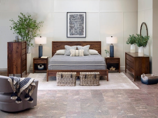 Rustic Walnut Dresser in decorated bedroom with bed, tall chest, nightstands, and rug
