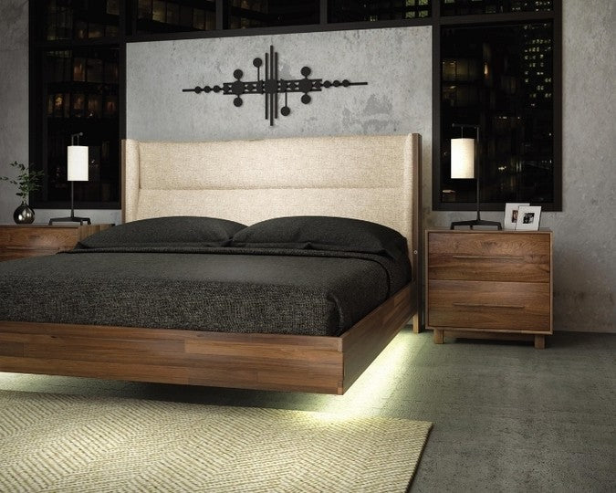 Sloane Floating Bed in walnut and Grade B Hemp fabric upholstery with under bed lighting in decorated room with nightstands and rug