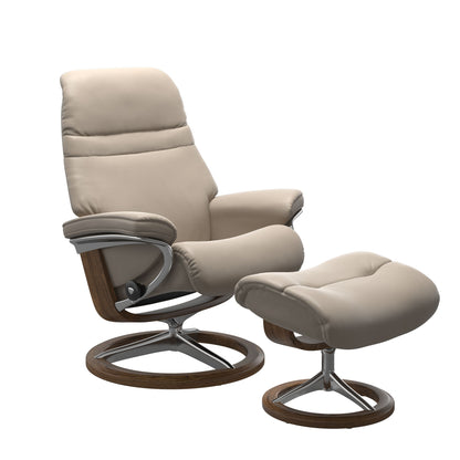 Mushroom colored sunrise recliner with matching ottoman featuring a curved base in metal and teak