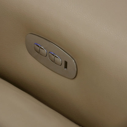 Close-up of a metallic control panel on a beige surface