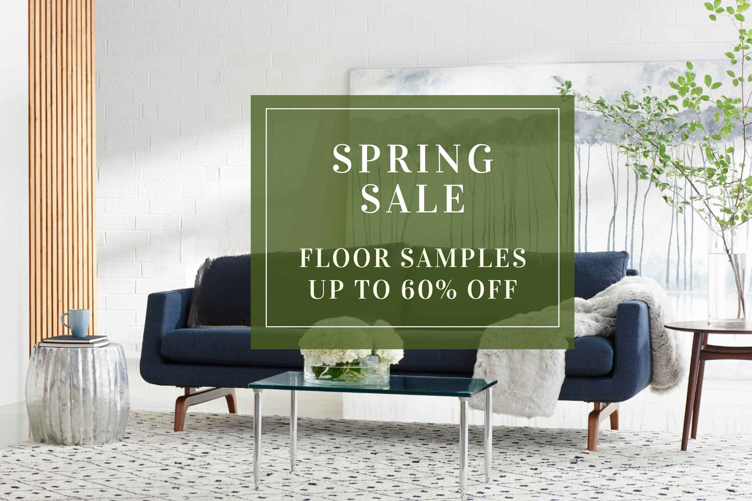 Living room with a blue sofa and a spring sale sign overlay.