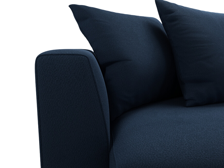 Close up of armrest and pillows on navy blue sofa