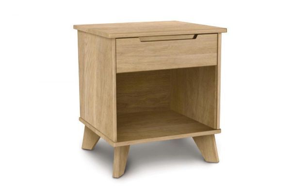 Wooden oak nightstand with one drawer, an open shelf, recessed handle and angled legs. 