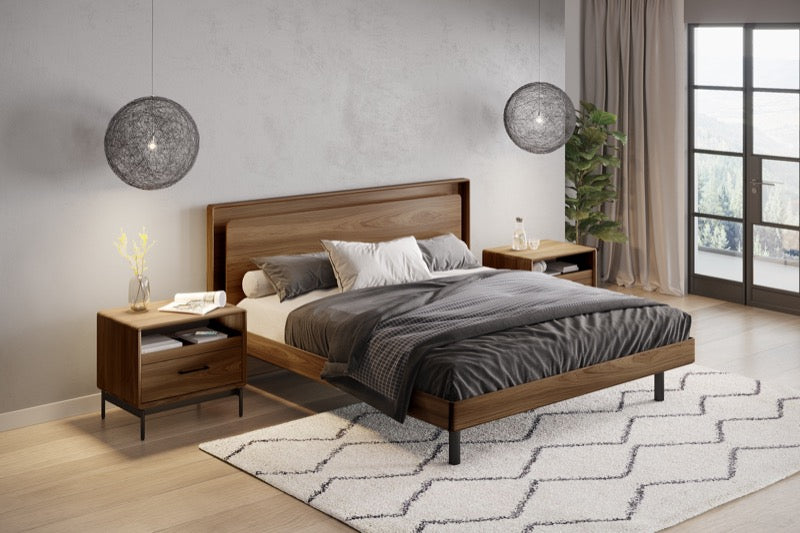 Up-Linq Bed in room with lighting, nightstands, and rug