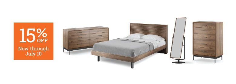 Wooden bedroom furniture set with a bed, dresser, and mirror on a white background, featuring a 15% off discount banner.