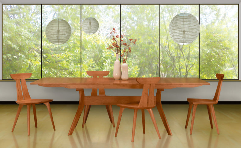Audrey Table in green, decorated room with Estelle Chairs Cherry