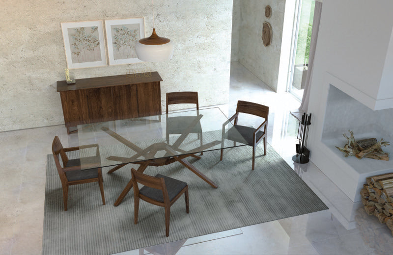 Exeter Glass Top Table walnut, overhead in decorated dining room with chairs, buffet, and rug