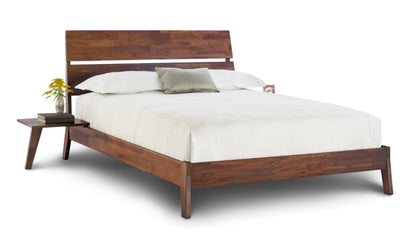 Linn Walnut Platform Bed with slatted headboard,  and angled legs and floating nightstand attached to bed. 