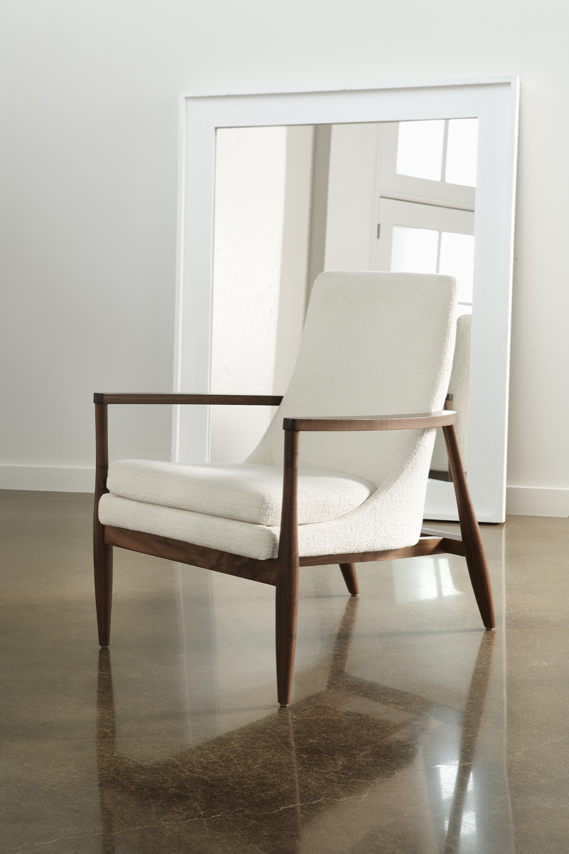 Modern Chair in beige leather and walnut wood arms and legs on tile floor