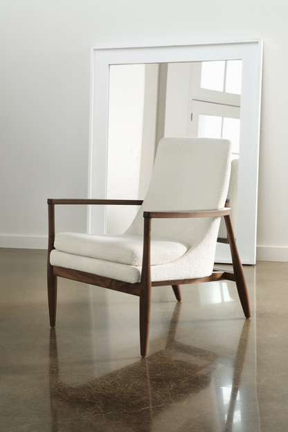Modern Chair in beige leather and walnut wood arms and legs on tile floor