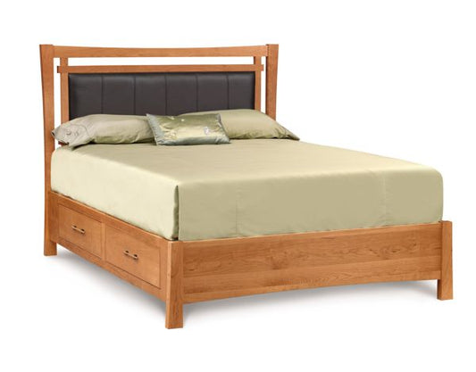 Monterey Bed with Storage and Upholstered Panel in cherry, angled view