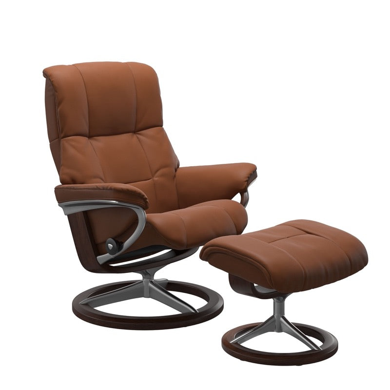 Cognac colored reclining chair with matching ottoman, both featuring padded cushions and brown circular base.