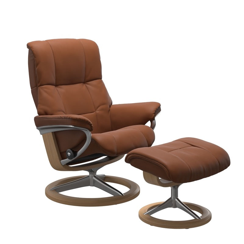 Cognac colored reclining chair with matching ottoman, both featuring padded cushions and oak circular base.