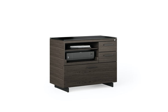 Staged side view of the Sequel 20 6116 Lateral File Cabinet by BDI Furniture in Charcoal Stained Ash