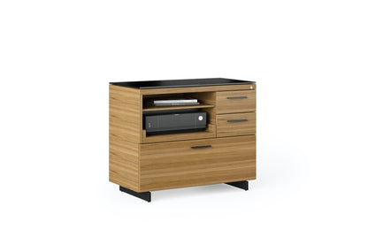 Staged side view of the Sequel 20 6116 Lateral File Cabinet by BDI Furniture in Natural Walnut