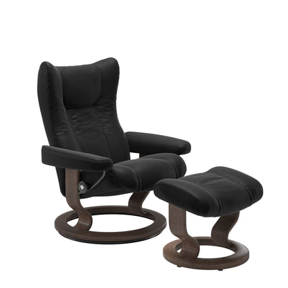 Stressless Wing Small Recliner in Paloma Black and Ottoman with Classic Base in walnut