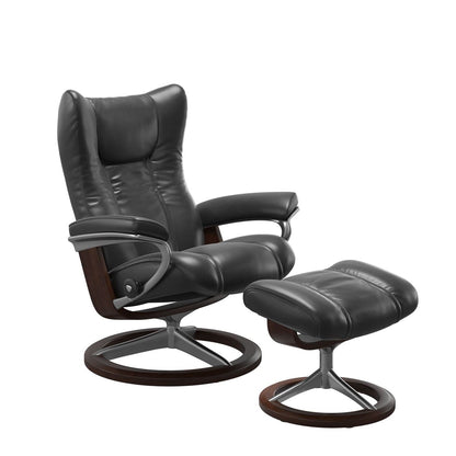 Stressless Wing Small Recliner in pioneer black and Ottoman with Classic Base in brown