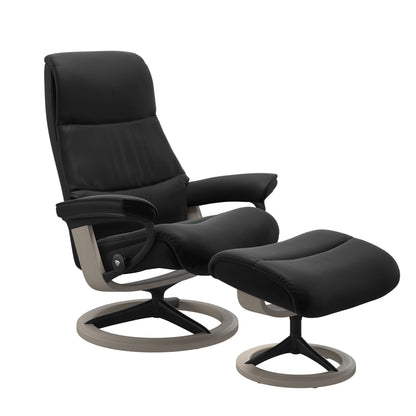 View recliner in Paloma Black with matching ottoman featuring a curved base in metal and whitewash