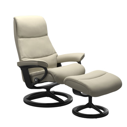 View recliner in Paloma Light Grey with matching ottoman featuring a curved base in metal and black