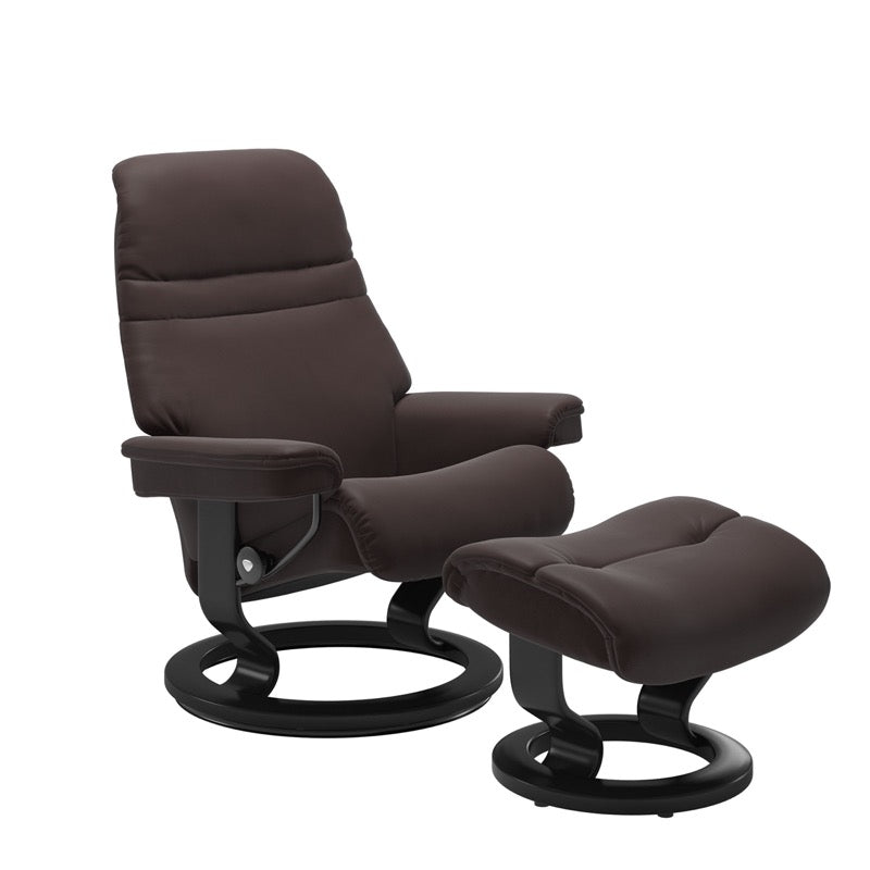 Chocolate colored sunrise recliner with matching ottoman both featuring a circular base in black wood. 