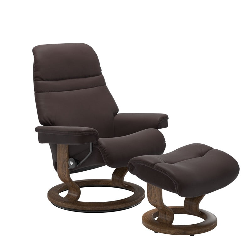 Chocolate colored sunrise recliner with matching ottoman both featuring a circular base in teak wood. 