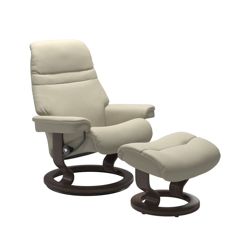 Light Grey colored sunrise recliner with matching ottoman both featuring a circular base in wenge wood. 