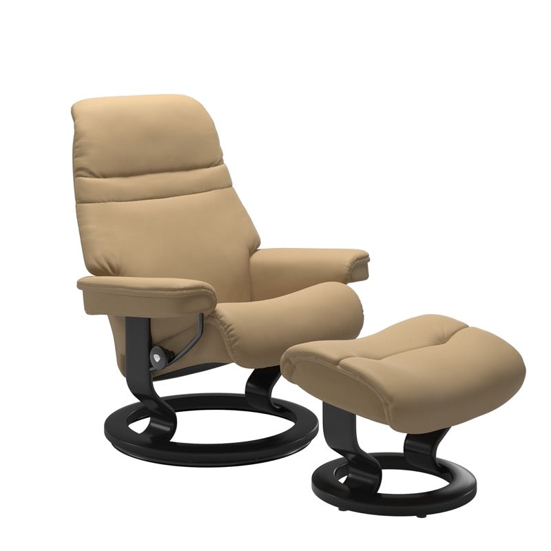 Sand colored sunrise recliner with matching ottoman both featuring a circular base in black wood 
